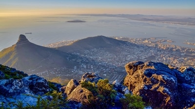 Climbing Table Mountain in Cape Town, South Africa, will reward you with a breathtaking view of the setting sun. The city lights start to sparkle against the starry night sky as the sun sets, creating a stunning image. (Unsplash) Climbing Table Mountain in Cape Town, South Africa, will reward you with a breathtaking view of the setting sun. The city lights start to sparkle against the starry night sky as the sun sets, creating a stunning image. (Unsplash)