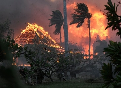 The hall of historic Waiola Church in Lahaina and nearby Lahaina Hongwanji Mission are engulfed in flames along Wainee Street on Tuesday, Aug. 8, 2023, in Lahaina, Hawaii. (Matthew Thayer/The Maui News via AP) (AP) The hall of historic Waiola Church in Lahaina and nearby Lahaina Hongwanji Mission are engulfed in flames along Wainee Street on Tuesday, Aug. 8, 2023, in Lahaina, Hawaii. (Matthew Thayer/The Maui News via AP) (AP)