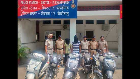 The snatchers and recovered motorcycles and scooters in the custody of Chandigarh Police. (HT Photo)