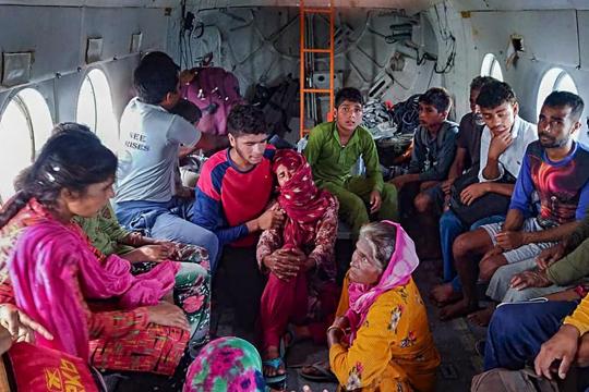 Villagers after they were evacuated by the Indian Air Force from flood-hit areas in Himachal Pradesh on Wednesday. (PTI Photo) Villagers after they were evacuated by the Indian Air Force from flood-hit areas in Himachal Pradesh on Wednesday. (PTI Photo)