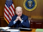 FILE PHOTO: U.S. President Joe Biden speaks on the phone with Russia's President Vladimir Putin about a possible Russian invasion of Ukraine, as Biden spends the weekend at the U.S. presidential retreat at Camp David, in this official White House handout photo released after the call took place in Thurmont, Maryland, U.S., February 12, 2022. 