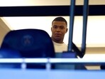Paris St Germain's Kylian Mbappe is seen in the stands ahead of a match.