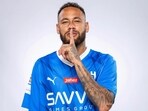 Al Hilal's new signing Neymar poses in their shirt after signing