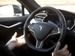 Autopilot features are demonstrated in a Tesla Model S.
