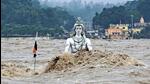 A partially submerged idol of Lord Shiva in the swollen Ganga river in Rishikesh, Uttarakhand on August 14. (PTI Photo)