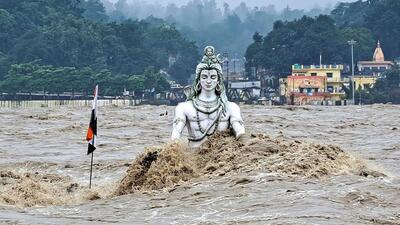 A partially submerged idol of Lord Shiva in the swollen Ganga river in Rishikesh, Uttarakhand on August 14. (PTI Photo) A partially submerged idol of Lord Shiva in the swollen Ganga river in Rishikesh, Uttarakhand on August 14. (PTI Photo)