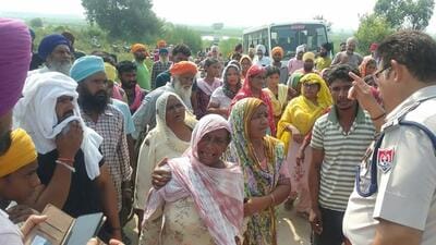 Family members of the two boys after their bodies were recovered from the seasonal nullah (drain) at Dhirowali village in Sri Hargobindpur sub division of Gurdaspur district on Thursday morning. (HT Photo)