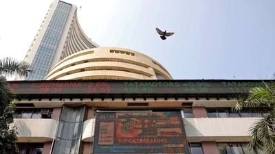 A bird flies past a screen displaying the Sensex results on the facade of the Bombay Stock Exchange (BSE) building in Mumbai. (REUTERS)