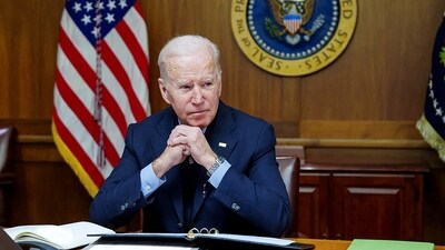 FILE PHOTO: U.S. President Joe Biden speaks on the phone with Russia's President Vladimir Putin about a possible Russian invasion of Ukraine, as Biden spends the weekend at the U.S. presidential retreat at Camp David, in this official White House handout photo released after the call took place in Thurmont, Maryland, U.S., February 12, 2022. (via REUTERS)
