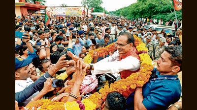 Madhya Pradesh Chief Minister Shivraj Singh Chouhan greets the public during ‘Jan Darshan’ programme at Kurwai. (PTI) Madhya Pradesh Chief Minister Shivraj Singh Chouhan greets the public during ‘Jan Darshan’ programme at Kurwai. (PTI)
