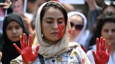 An Afghan national with her hands and face painted takes part with others in a demonstration against the Taliban government in Islamabad on August 15 on the occasion of the second anniversary of the Taliban takeover of Afghanistan. (AFP) An Afghan national with her hands and face painted takes part with others in a demonstration against the Taliban government in Islamabad on August 15 on the occasion of the second anniversary of the Taliban takeover of Afghanistan. (AFP)