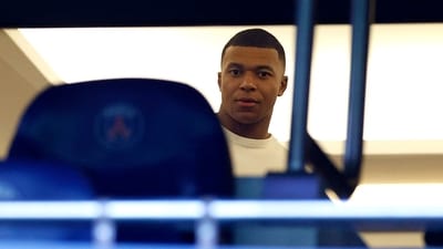 Paris St Germain's Kylian Mbappe is seen in the stands ahead of a match. (REUTERS)