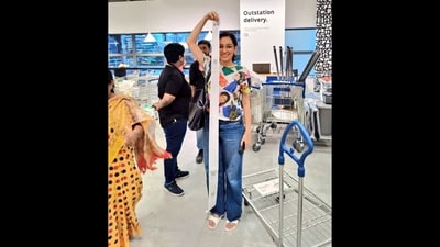 IKEA shopper in Hyderabad store posing with a bill as tall as her. (Twitter/@sameeracan) IKEA shopper in Hyderabad store posing with a bill as tall as her. (Twitter/@sameeracan)