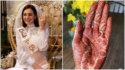 Dia Mirza is known for her classy and elegant looks and her henna design matched her aesthetic. The actress wore a beautiful orange mehendi with mandala designs, floral motifs and intricate patterns. So, if you are someone who loves heavy mehendi patterns but doesn't want to go overboard, take inspiration from Diya and rock your Teej mehendi look. (Instagram) Dia Mirza is known for her classy and elegant looks and her henna design matched her aesthetic. The actress wore a beautiful orange mehendi with mandala designs, floral motifs and intricate patterns. So, if you are someone who loves heavy mehendi patterns but doesn't want to go overboard, take inspiration from Diya and rock your Teej mehendi look. (Instagram)