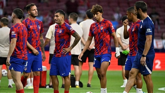 Atletico Madrid's Portuguese forward #18 Joao Felix (3R) and teammates warm up prior the Spanish Liga football match (AFP)