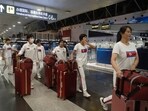 North Korean women wearing track suits with the North Korean flag and the words Taekwon-Do printed on the back, walk to check-in for a flight to Astana at the Capital Airport in Beijing, Friday, Aug. 18, 2023. A team of North Korean Taekwondo athletes are reportedly travelling via China to Astana, capital of Kazakhstan, to compete in a Taekwondo competition. North Korea may open its sealed border post Covid-19 with dispatch of sports delegation 