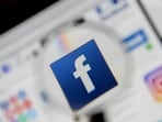 FILE PHOTO: The Facebook logo is seen on a screen in this picture illustration taken December 2, 2019. 