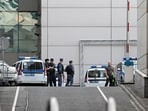 Police officers stand guard at the scene of the wreckage of a drone at the "Moscow City" business district after a reported drone attack in Moscow, Russia on Friday. Police officers stand guard at the scene of the wreckage of a drone at the "Moscow City" business district after a reported drone attack in Moscow, Russia on Friday.