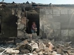 A local resident clear debris in her house destroyed as a result of missiles strike to Kherson A local resident clear debris in her house destroyed as a result of missiles strike to Kherson