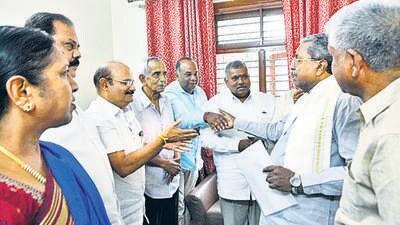 A Karnataka Contractors’ Association delegation with chief minister Siddaramaiah. The association had written to the Prime Minister about 40% commission being charged on public projects. (ANI) A Karnataka Contractors’ Association delegation with chief minister Siddaramaiah. The association had written to the Prime Minister about 40% commission being charged on public projects. (ANI)