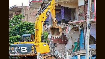 A bulldozer being used to demolish an ‘illegally constructed’ hotel in violence-hit Nuh. (PTI) A bulldozer being used to demolish an ‘illegally constructed’ hotel in violence-hit Nuh. (PTI)