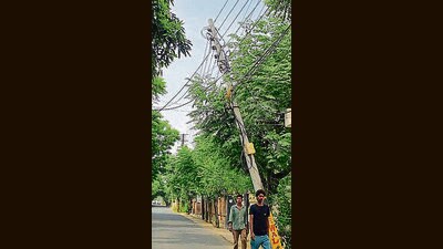 A view of tilted electricity poles in Guru Ram Das Colony in Ludhiana on Friday (HT Photo) A view of tilted electricity poles in Guru Ram Das Colony in Ludhiana on Friday (HT Photo)