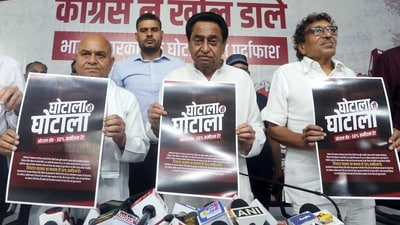 Madhya Pradesh Congress president Kamal Nath along with party supporters show posters alleging a 50% commission corruption charge against the state government. (ANI) Madhya Pradesh Congress president Kamal Nath along with party supporters show posters alleging a 50% commission corruption charge against the state government. (ANI)
