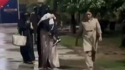 Nikhat Ansari’s son, a toddler, was at the prison gate with a family member to receive her (Video grab) Nikhat Ansari’s son, a toddler, was at the prison gate with a family member to receive her (Video grab)