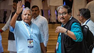 RJD chief Lalu Prasad Yadav with JDU's Manoj Jha in Bengaluru to attend the opposition parties' meet in July (PTI File Photo)