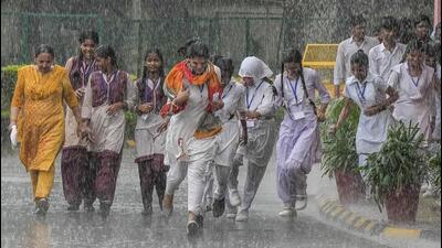 Students enjoy the rains in New Delhi earlier this week. (PTI Photo) Students enjoy the rains in New Delhi earlier this week. (PTI Photo)