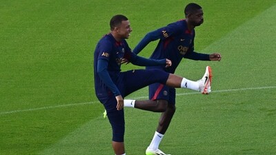 Paris Saint-Germain's forwards Kylian Mbappe and Ousmane Dembele take part in a training session (AFP) Paris Saint-Germain's forwards Kylian Mbappe and Ousmane Dembele take part in a training session (AFP)