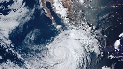 This handout satellite image courtesy of NOAA taken on August 16, 2023, shows hurricane Hilary approaching Baja California, Mexico. Tropical Storm Hilary strengthened into a major hurricane in the Pacific on August 16, 2023 and was expected to further intensify before approaching Mexico's Baja California peninsula over the weekend, forecasters said. Heavy rainfall was also expected in the southwestern United States from Friday as the storm moves north, the US National Hurricane Center (NHC) said. (AFP) This handout satellite image courtesy of NOAA taken on August 16, 2023, shows hurricane Hilary approaching Baja California, Mexico. Tropical Storm Hilary strengthened into a major hurricane in the Pacific on August 16, 2023 and was expected to further intensify before approaching Mexico's Baja California peninsula over the weekend, forecasters said. Heavy rainfall was also expected in the southwestern United States from Friday as the storm moves north, the US National Hurricane Center (NHC) said. (AFP)