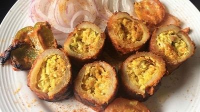 Bharwan Aloo: This is a north Indian appetizer in which potato cases are stuffed with paneer, spices and baked till golden brown. It is the best snack for the rainy season along with a cup of tea. (Instagram/@hungryladki) Bharwan Aloo: This is a north Indian appetizer in which potato cases are stuffed with paneer, spices and baked till golden brown. It is the best snack for the rainy season along with a cup of tea. (Instagram/@hungryladki)