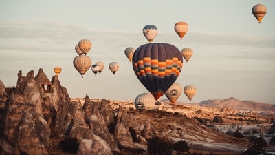 Cappadocia, Turkey: It is a real-life illustration of how strange and beautiful nature can be. It shows a fantastic environment that seems to have come straight out of a fairy tale, complete with stones and hills that resemble alien terrain. With many hot air balloons that fill the sky with reds, yellows, oranges and creams, the landscape looks extremely breathtaking.&nbsp; (Unsplash/Timur Garifov)