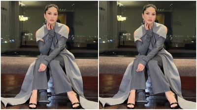 Sunny looked stunning in a long grey blazer with full sleeves and cut-our details at the shoulders. The blazer came with a black belt at the waist. In matching grey formal trousers, Sunny completed her look. (Instagram/@sunnyleone) Sunny looked stunning in a long grey blazer with full sleeves and cut-our details at the shoulders. The blazer came with a black belt at the waist. In matching grey formal trousers, Sunny completed her look. (Instagram/@sunnyleone)