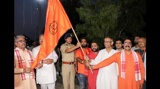 Additional director general of police Mukesh Singh flagging off the first batch of pilgrims for the Budha Amarnath Yatra in Jammu on Friday. (ANI Photo)