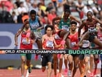 India's Avinash Mukund Sable, Ethiopia's Getnet Wale, Kenya's Simon Kiprop Koech, and other athletes compete in the Men's 3000m steeplechase heats during the World Athletics Championships