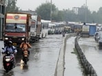 Commuters wading through traffic jam after rain at National Highway-48 near Narsinghpur village, in Gurugram. (Photo by Parveen Kumar/Hindustan Times) Commuters wading through traffic jam after rain at National Highway-48 near Narsinghpur village, in Gurugram. (Photo by Parveen Kumar/Hindustan Times)
