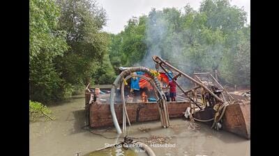 Crackdown on sand dredging; two barges destroyed in Bhiwandi Crackdown on sand dredging; two barges destroyed in Bhiwandi