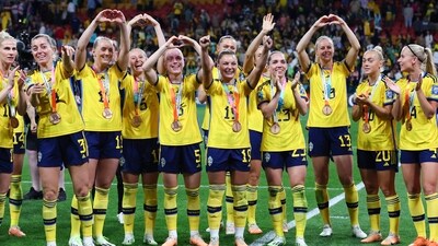 Sweden gesture to supporters as they celebrate with their bronze medals after defeating Australia (AP) Sweden gesture to supporters as they celebrate with their bronze medals after defeating Australia (AP)