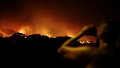 Canary Islands regional president Fernando Clavijo told reporters in a late-night briefing that Friday's firefighting efforts "progressed well, although the fire is still out of control."&nbsp; (REUTERS)