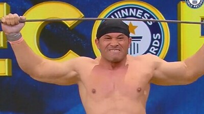 The image shows the Indian man who bagged a record by bending iron rods with his head. (Twitter/@GWR) The image shows the Indian man who bagged a record by bending iron rods with his head. (Twitter/@GWR)