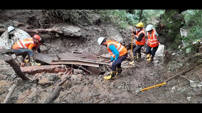 Rescue and search operation is underway by National Disaster Response Force (NDRF) personnel in the landslide-affected areas after heavy rainfall, in Shimla on Saturday. (ANI)