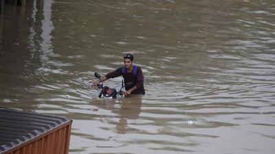A motorcyclist seen crossing waist-deep water filled stretch in Gurugram on Saturday. (Photo by Parveen Kumar/Hindustan Times) A motorcyclist seen crossing waist-deep water filled stretch in Gurugram on Saturday. (Photo by Parveen Kumar/Hindustan Times)