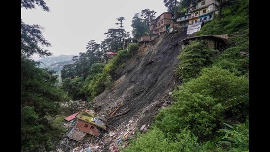 A landslide affected area where several buildings were damaged after heavy rains, at Krishna Nagar ward in Shimla, Saturday. (PTI)