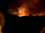 Spain Wildfire: People watch wildfire burning in Ravelo, Tenerife, Canary Islands, Spain.