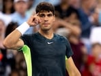 Carlos Alcaraz, of Spain, looks over at his coach after defeating Hubert Hurkacz, of Poland, during the semifinal of the Western & Southern Open