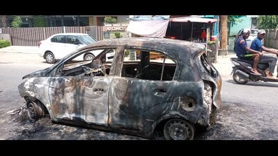A Santro car gutted in fire near Rajguru Nagar on intervening night between Saturday and Sunday in Ludhiana. (HT Photo)