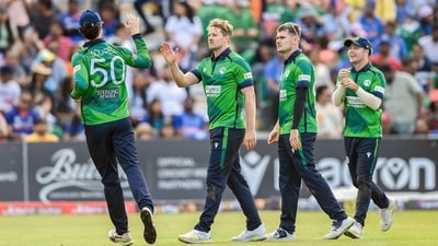 Ireland's Barry McCarthy and teammates celebrate a dismissal during the 2nd T20I against India at The Village in Dublin on Sunday. (Ireland Cricket Twitter)