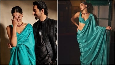 Ananya's teal silk saree is from the shelves of the clothing label Ekaya Banaras. She draped the six yards elegantly in traditional style, pleating it neatly on the front and letting the pallu fall from the shoulder in a midriff-baring, floor-sweeping length. For accessories, Ananya chose a gold bracelet, a ruby-adorned gold choker necklace, and matching earrings. (Instagram) Ananya's teal silk saree is from the shelves of the clothing label Ekaya Banaras. She draped the six yards elegantly in traditional style, pleating it neatly on the front and letting the pallu fall from the shoulder in a midriff-baring, floor-sweeping length. For accessories, Ananya chose a gold bracelet, a ruby-adorned gold choker necklace, and matching earrings. (Instagram)